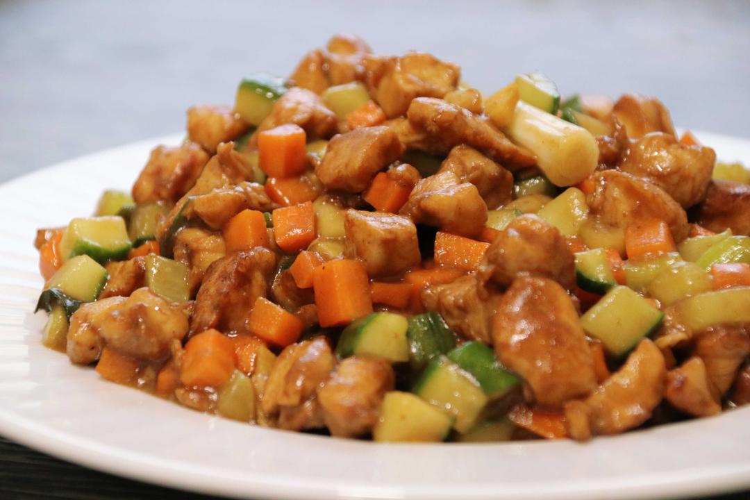 Kung Pao Chicken with a twist—this version is sweet and sour, not spicy, making it a favorite for all ages.